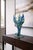 Contemporary hand-blown studio art glass sculpture in layered blue, teal, and chartreuse tones with dramatic freeform...