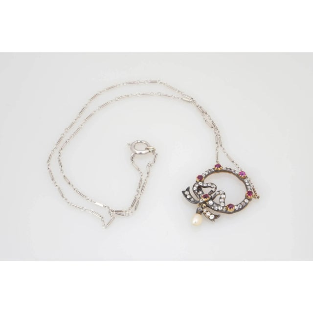 A rare and delicately crafted antique turn of the century Edwardian Belle Époque necklace pendant with an emblematic for...