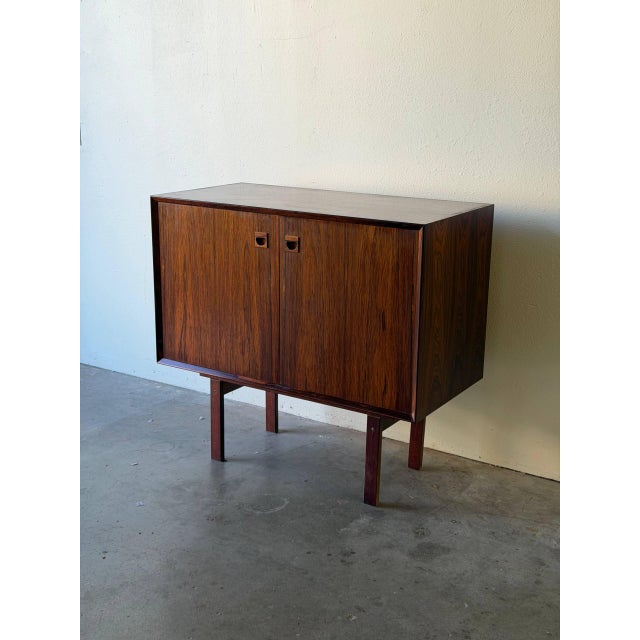 This beautiful vintage Danish rosewood cabinet in style of Brouer is a refined example of classic Scandinavian Mid Century...