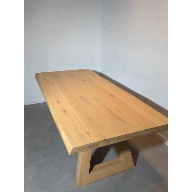 This solid oak dining table combines timeless design with robust construction. Crafted from natural oak, the table...