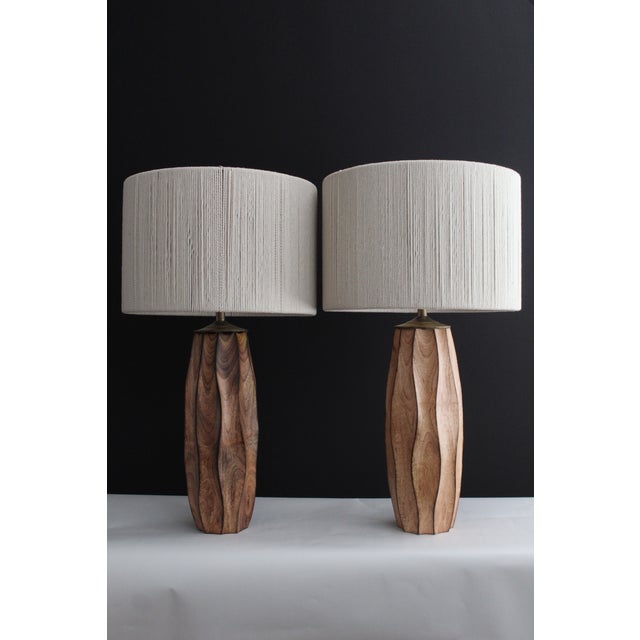 Pair of Westwood studios style .lamps. Hand carved rubbed finish embellished by carved waves giving pieces more depth....