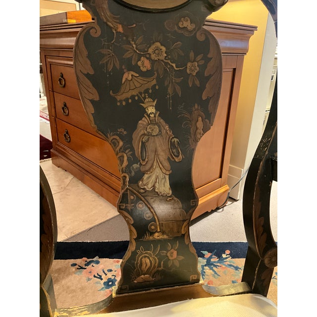 Late 19th Century Chinoiserie Asian Chair. This vintage armchair features a black lacquer finish with gold-painted...