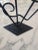 Vintage Art Deco Wrought Iron Valet Stand, Circa 1930s. The black, iron stand features quintessential Art Deco geometric...
