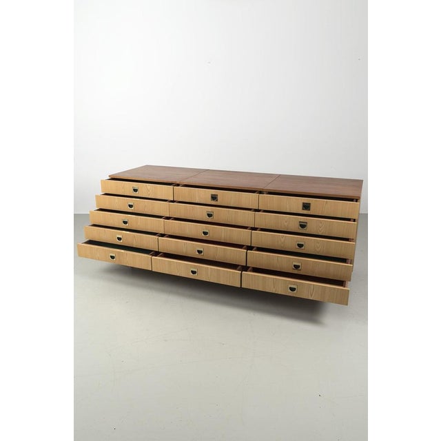 Beautiful, upcycled, vintage sideboard with 12 deep drawers and stylish brass handles. The sideboard has a sleek...