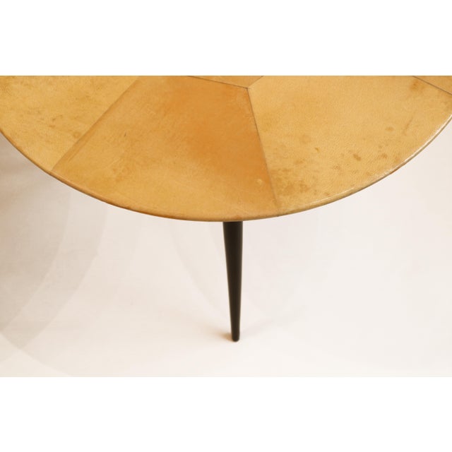 Pair of small Aldo Tura Modernist round side tables. Tops covered in geometric parchment segments and resting on a tripod...