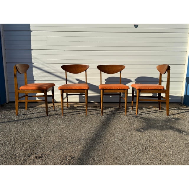 Set of 4 Mid-Century Modern Walnut Shell Back Dining Chairs Offered is a vintage Set of Mid-Century Modern Walnut Shell...