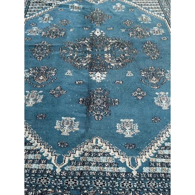 Beautiful mid-century Moroccan rug with a geometrical and tribal design with central medallion and stylized flowers and a...