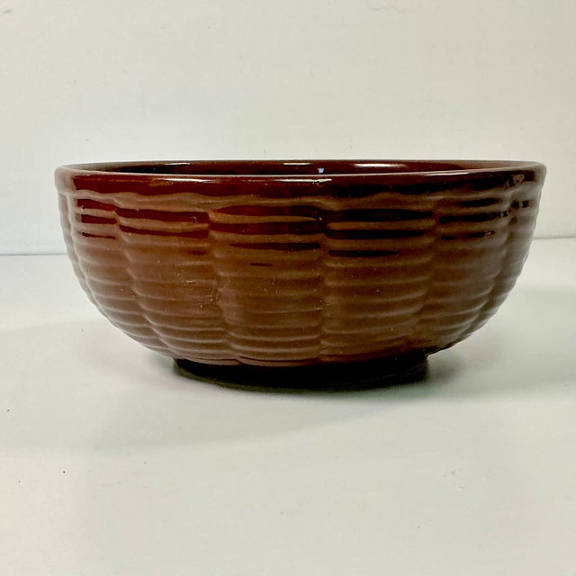 This vintage Brown Glaze Round Serving Bowl is from the 1970s. The Boho Chic Brutalist style mixes well with a causal...