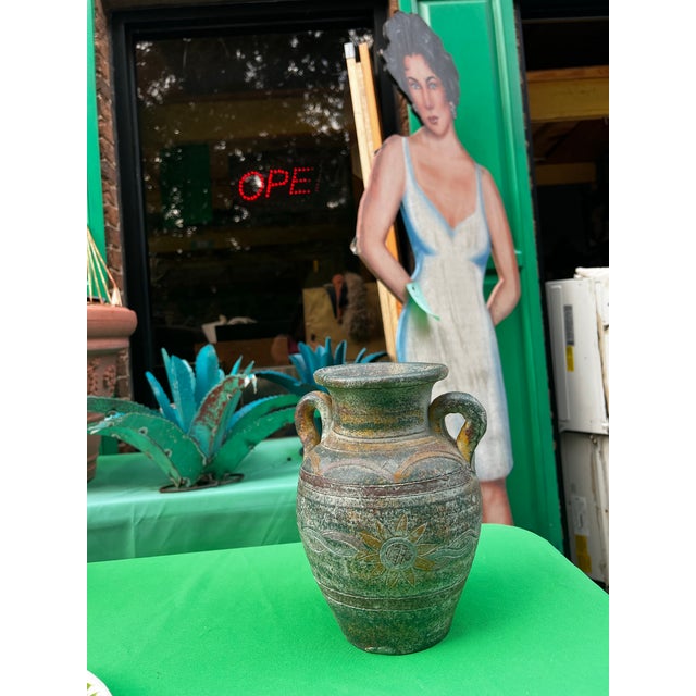 Up for consideration is a beautiful vintage handmade vintage pottery vase with sunflower details. This would look lovely...