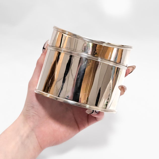 A fine signed silver dresser box or tea caddy. By Tiffany & Co. In sterling silver. In a navette form with a curved,...