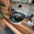 Add a sense of grounded luxury to your bathroom with our hand-carved river stone vessel sink. Unearthed from Indonesian...