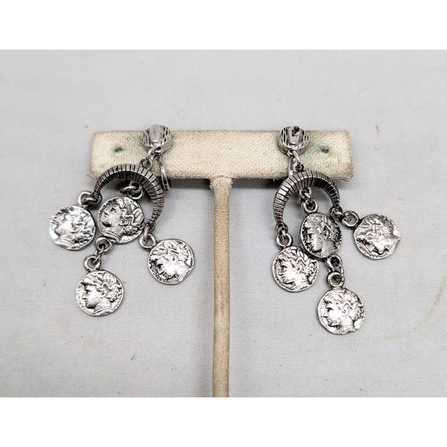 1970s Vintage 1970s Signed Crown Trifari Rhodium Plated Alexander the Great "Coin" Chandelier Clip Earrings-2 Pieces For Sale - Image 5 of 8