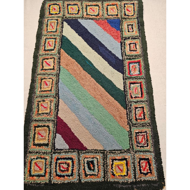 Vintage American hand hooked rug in a stripe pattern handcrafted in the 4th quarter of the 1800s in the New England Area...