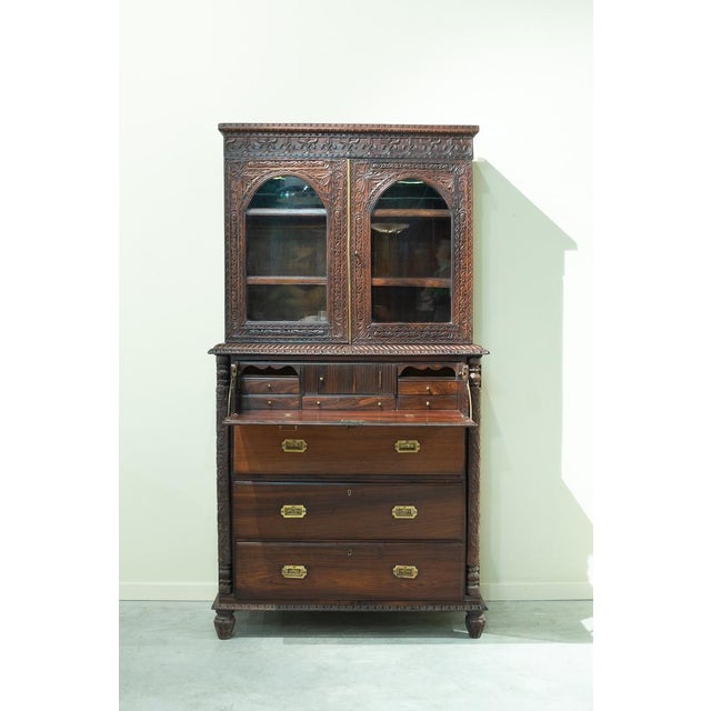 Bookcase on drawers with desk, Anglo-Indian, Bombay, 19th century. The upper part of the piece is structured as a bookcase...