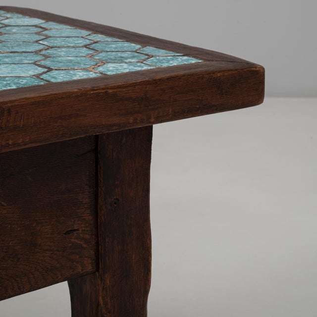 This 1970s French wooden coffee table showcases a stunning fusion of craftsmanship and color. The solid wood frame...