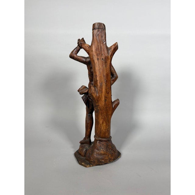 The Martyrdom of Saint Sebastian in carved wood. Saint Sebastian sculpted in the round. French work from the 17th century....
