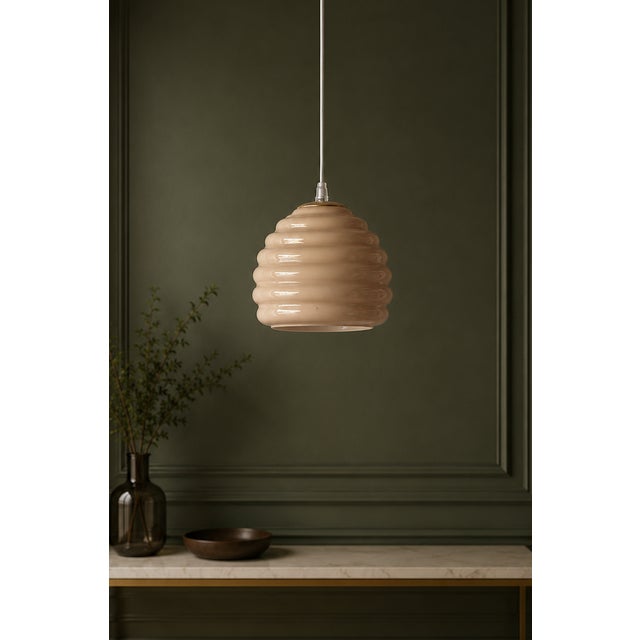 Dune s murano lamp is an elegant chandelier in authentic murano glass, characterized by sinuous and refined forms. The...