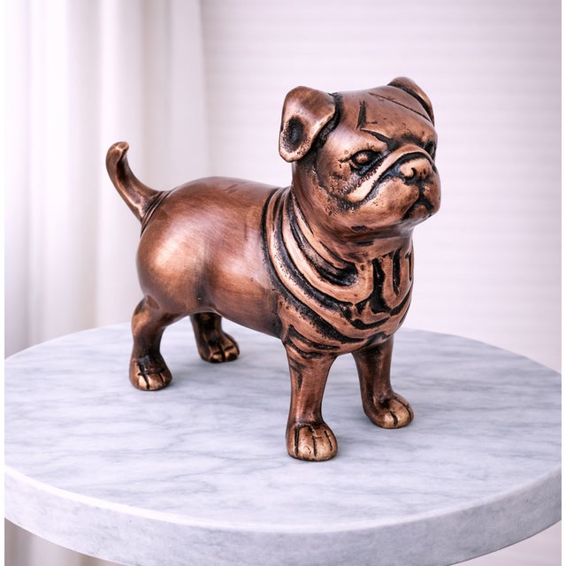 Enhance your home décor with this elegant antique-style pug dog sculpture, beautifully crafted from real metal and...