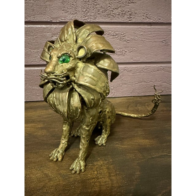 Sergio Alvarado brass lion figurine. Lions are symbols of prosperity, leadership, and protection. This magnificent piece’s...