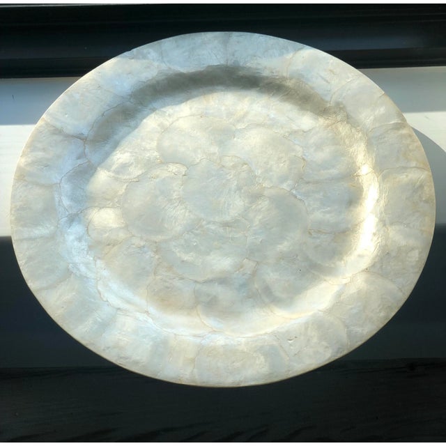 If you like pina coladas and getting lost in the rain, you will love this capriz shell tray and give it the home it...