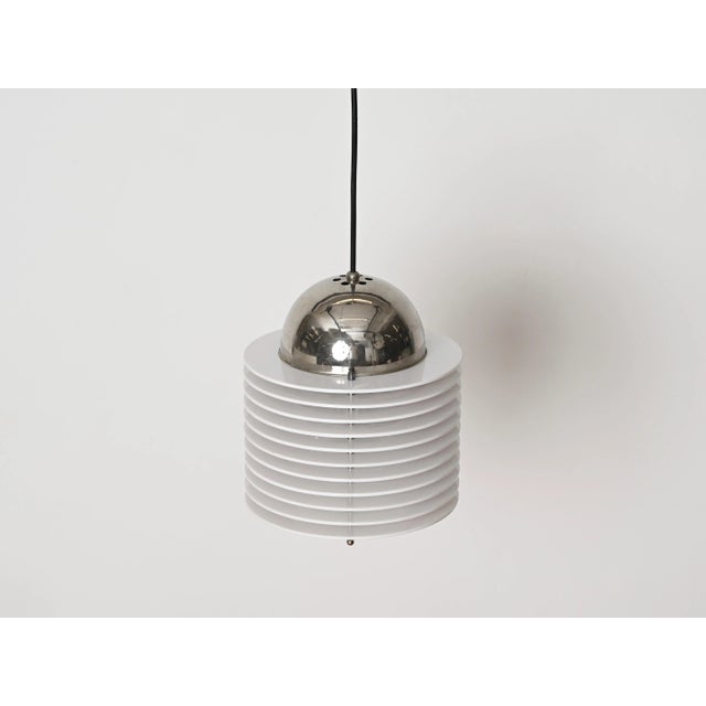 Lovely space age italian pendant light in a beautiful combination of chromed metal and white lucite. This stylish mid-...