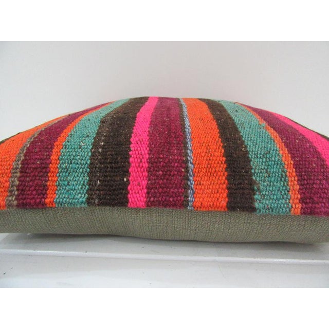 This is a pillow cover made from a vintage kilim rug. The piece was properly washed and ready to use. Pillow inserts not...