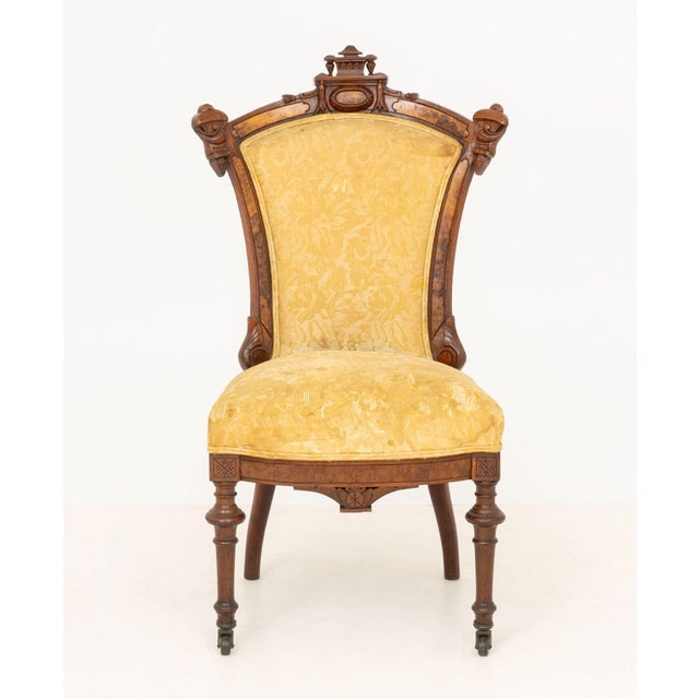 Aesthetic Movement Walnut Side Chair, with geometric crest, burl walnut inlay, and butter yellow floral upholstered seat...