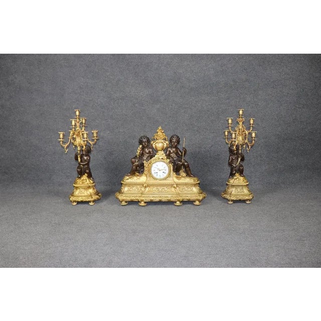 An extraordinary, museum-quality 19th-century French Louis XV style 3-piece figural clock set (garniture de cheminée)...