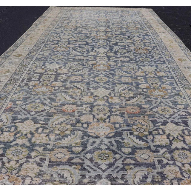 Measures: 5'1 x 11'9 Antique Persian Hamadan Gallery Rug With Floral Motifs in Soft Blues and Creams 5'1 X 11'9. Keivan...