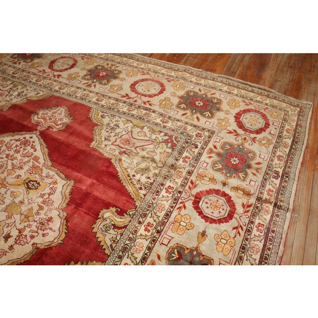 A magnificent square shaped formal antique Turkish rug containing a pretty array of jewel tones, an isolated central...
