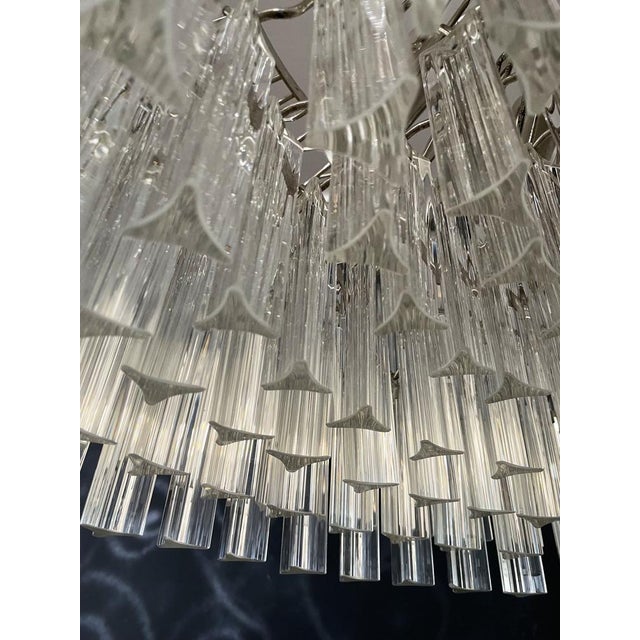 A magnificent murano glass chandelier, 265 triedri on crome frame. This large mid-century italian chandelier is truly a...