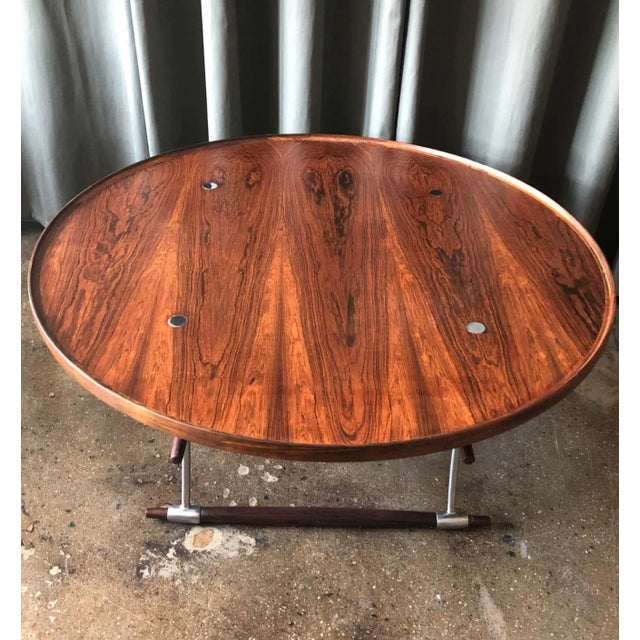 Stokke coffee table designed by Jens Quistgaard for Nissen, Denmark, circa 1960. Rosewood and polished metal. Excellent...