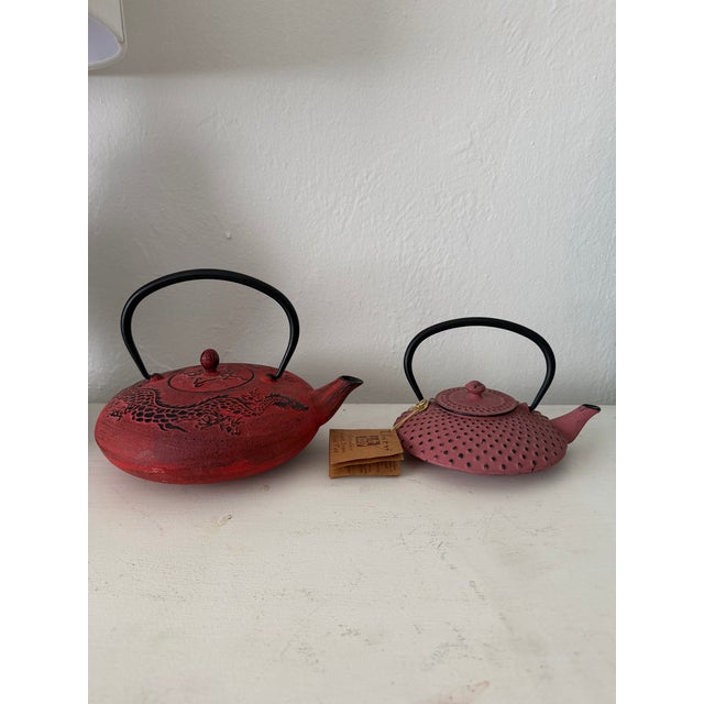 Vintage never used pair of Asian cast iron enameled brick red tea pots. Teapot Dimensions: Large 10.5” W x 8.5” D x 8” H...