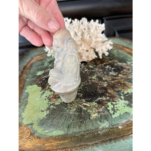 Fabulous carved soapstone presented as a reclining Buddha. Color of a taupe and soft peach, chinese writing tiny down the...