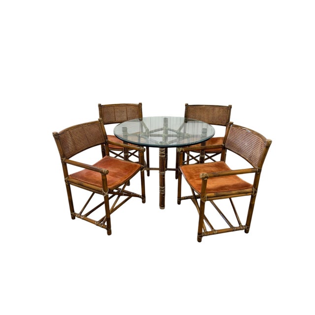 This is an iconic McGuire Furniture five piece dinning set, crafted in the company's signature bamboo and rattan...