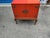 Antique Chinese cabinet with queen ann base made of walnut. The color is orange red. The stand is sound, well made. Circa...