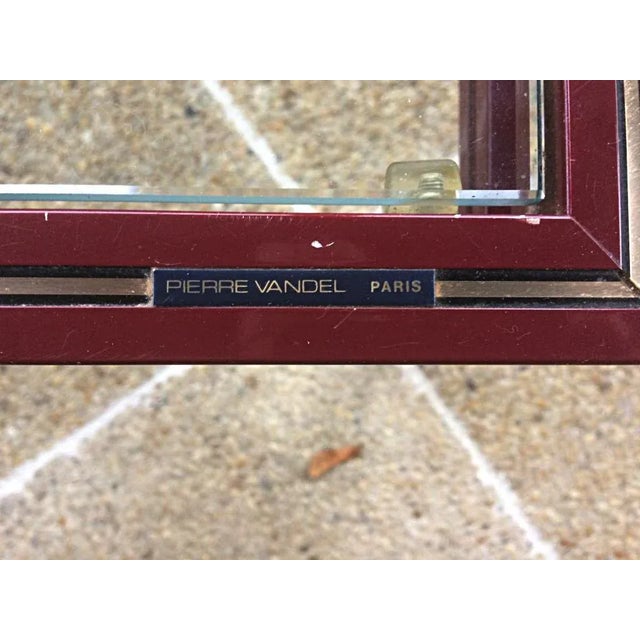 Vandel stone coffee table burgundy lacquered gilded fillets signed on a crosspiece circa 70. This piece is attributed to...