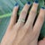 This elegant floral-inspired diamond band features a delicate arrangement of round brilliant diamonds set in a star-floral...