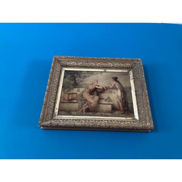 Diana Coomans – “Le Messager de l'Amour” (1890) – Reverse Glass Artwork, Signed – Gilded Frame, Framer Stamp Description:...