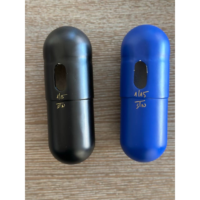 Ceramic Love & Hope Pills Wall Sculptures by Tal Nehoray Ceramic sculpture, automotive paint 18.5 cm long 6.5 cm in diameter