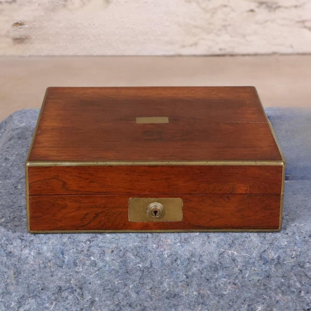 This 19th Century English Mahogany Valet Box is a refined and functional antique that reflects the elegance and...