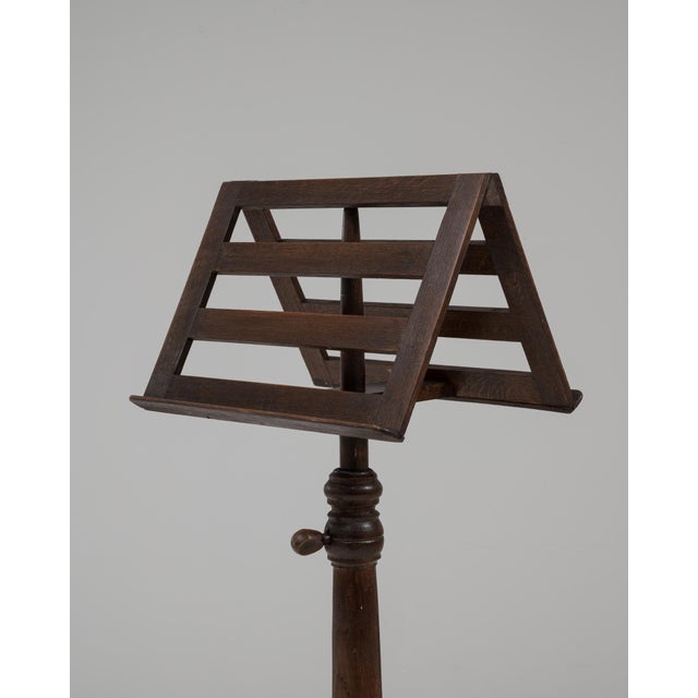 1900s French wooden music stand featuring a finely crafted adjustable frame and tripod base. Made from richly toned wood,...