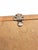 A distinctive antique picture frame dating to approximately the 1920s. The narrow wood frame features a repeating hand-...