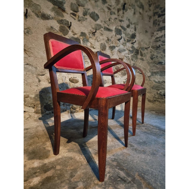 This pair of armchairs was made in France in the 1930s. The frames are constructed from solid beech wood with curved...