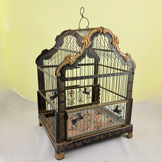 A scarce Art Nouveau painted metal or Jappaned bird cage, possibly German, circa 1900-1920. The black square cage shows a...