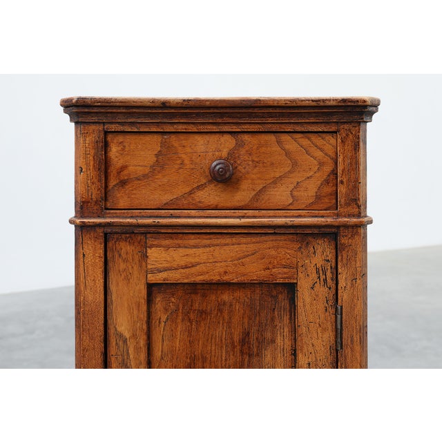 A charming Belgian Art Deco bedside cabinet from the 1920s, crafted in solid walnut with a warm, aged patina. The design...