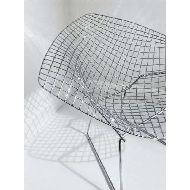 Elevate your space with a true masterpiece of mid-century modern design: the iconic Bertoia Diamond Chair, originally...