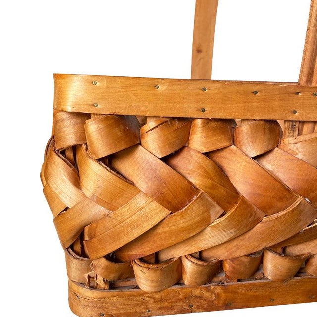 A decorative "porcupine" woven wood basket with a handle. Dimensions: 15.5" Wide 12.5" Deep 15" Tall