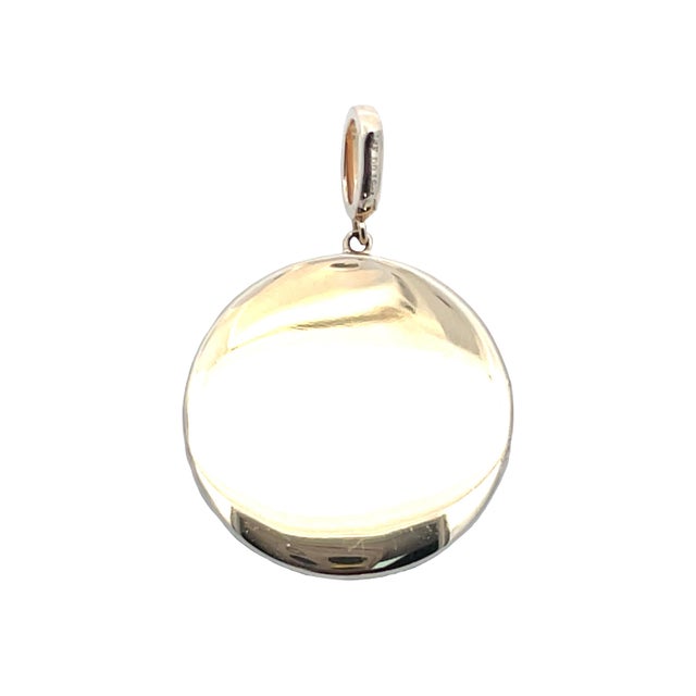 Striking 14K yellow gold Sagittarius zodiac charm featuring a textured round medallion with twin-figure motif, accented by...