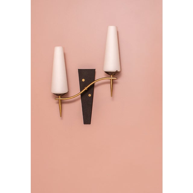 Set of 2 Mid Century Modern wall sconces with white cone shades and vivid brass France, 1950s opaline glass, brass, enamel...